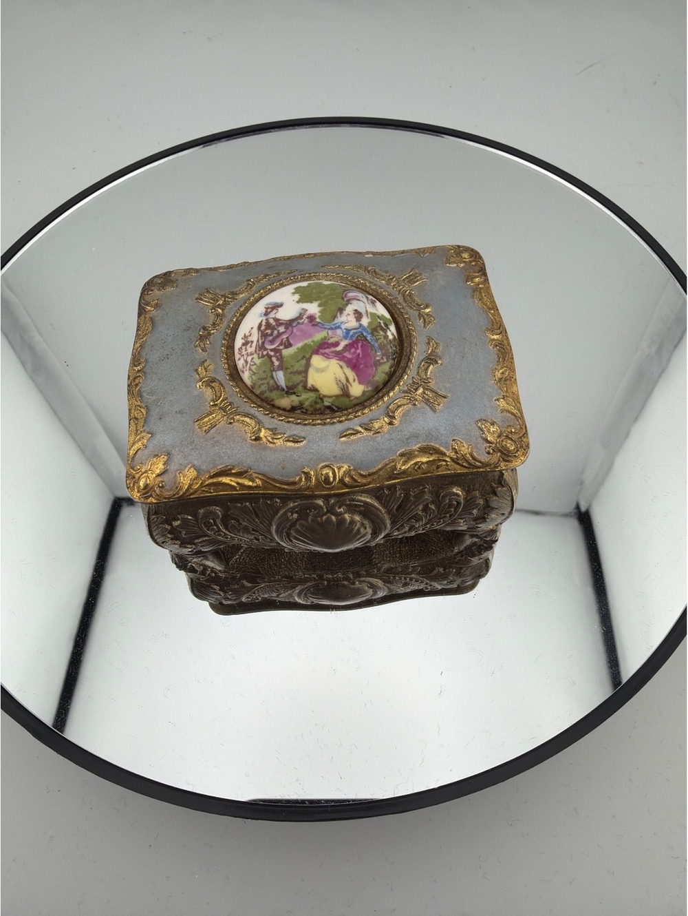 mid-20th-century gilt metal and porcelain trinket box with a courting couple.